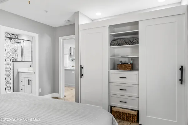 a bedroom with a bed and a closet