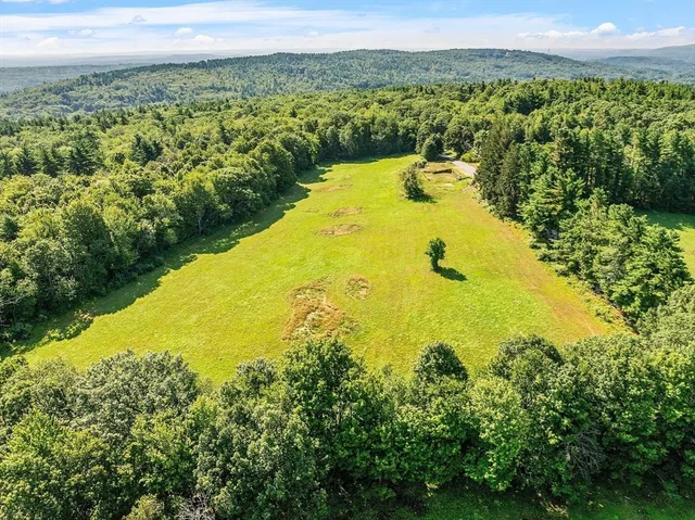 a view of a lake with a yard