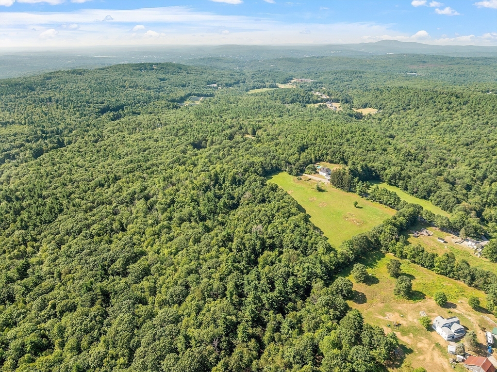Lot 7 Old Northfield Road Ashby, MA 01431 - Photo 6 of 18 an aerial view of residential houses with outdoor space and trees