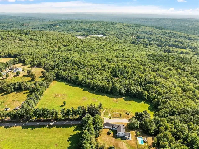 a view of a lake with a yard