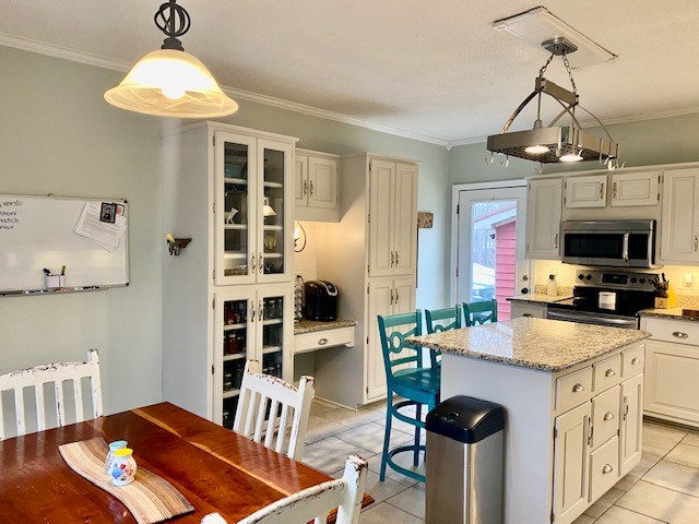 796 Dripping Springs Road Winchester, TN 37398 - Photo 12 of 34 a kitchen with stainless steel appliances granite countertop a stove and a refrigerator