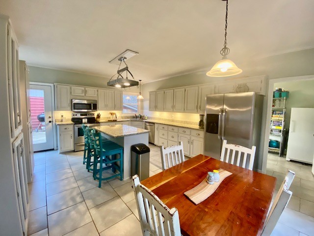 796 Dripping Springs Road Winchester, TN 37398 - Photo 14 of 34 a kitchen with stainless steel appliances kitchen island granite countertop a refrigerator a stove top oven a sink and dishwasher