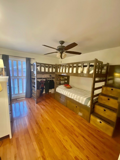 796 Dripping Springs Road Winchester, TN 37398 - Photo 20 of 34 a view of a livingroom with wooden floor and a ceiling fan