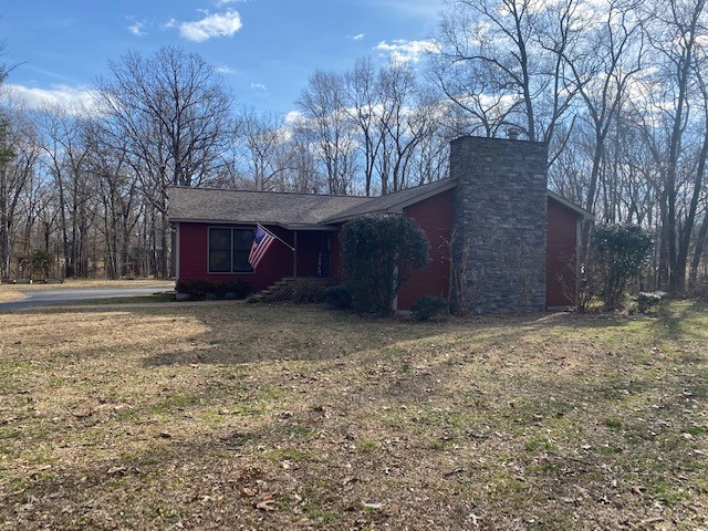 796 Dripping Springs Road Winchester, TN 37398 - Photo 2 of 34 a front view of a house with a yard and garage