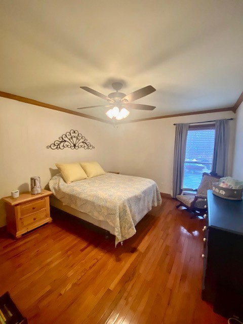 796 Dripping Springs Road Winchester, TN 37398 - Photo 21 of 34 a bedroom with a bed and wooden floor