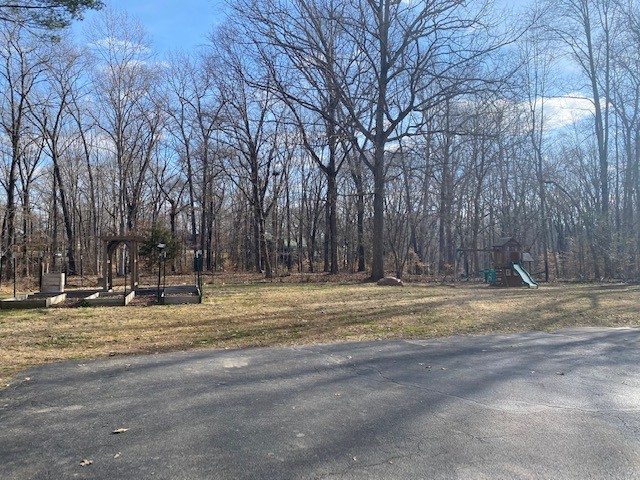 796 Dripping Springs Road Winchester, TN 37398 - Photo 33 of 34 a view of a house with a yard covered with snow