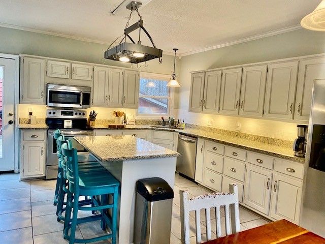 796 Dripping Springs Road Winchester, TN 37398 - Photo 9 of 34 a kitchen with granite countertop a sink appliances and cabinets