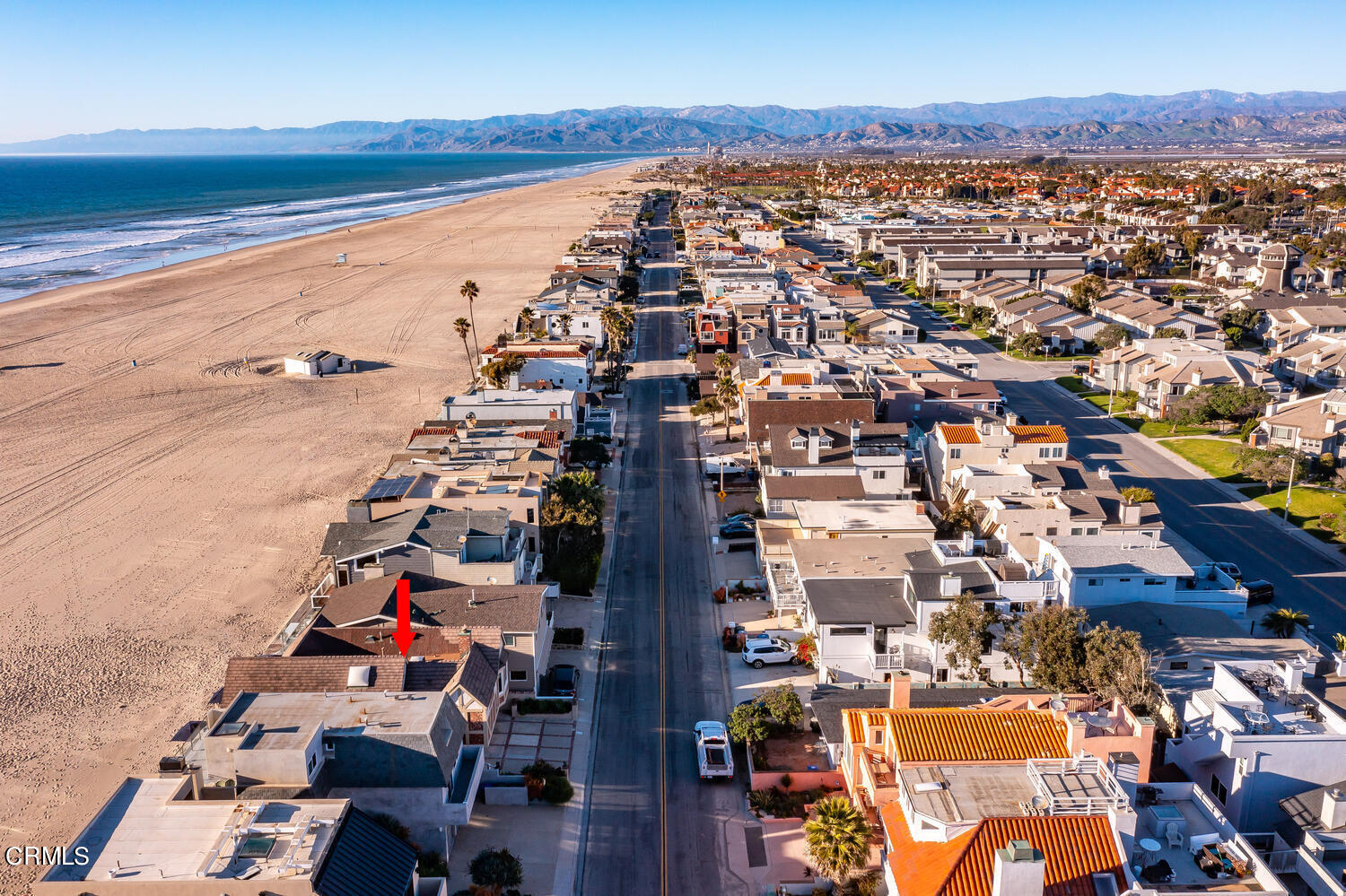 an aerial view of residential building and ocean