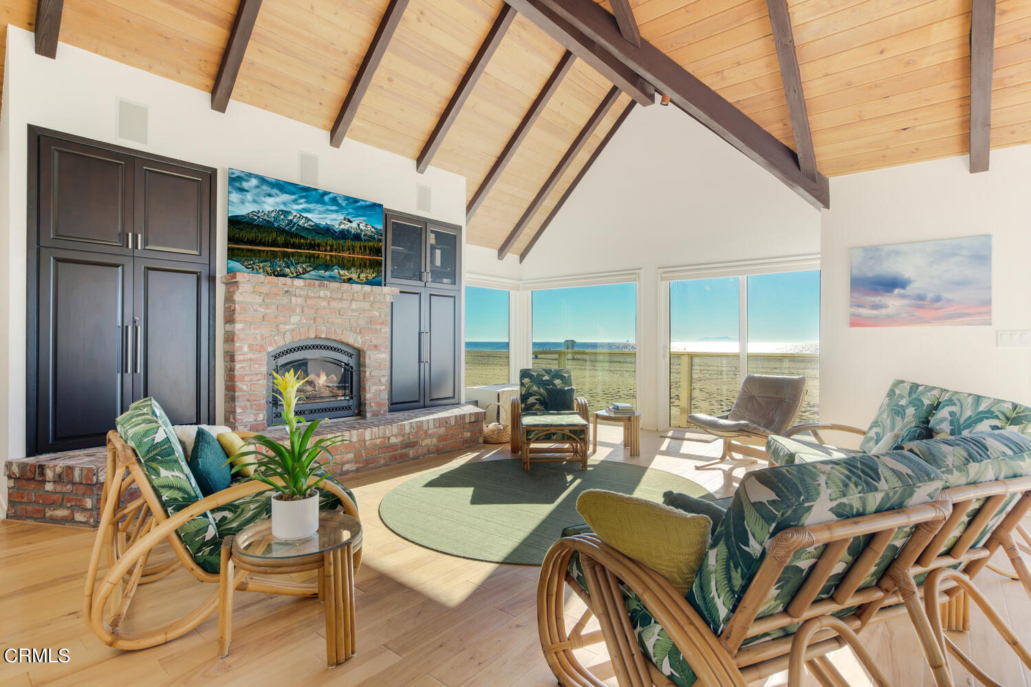 3817 Ocean Drive Oxnard, CA 93035 - Photo 11 of 51 a living room with furniture a fireplace and a table