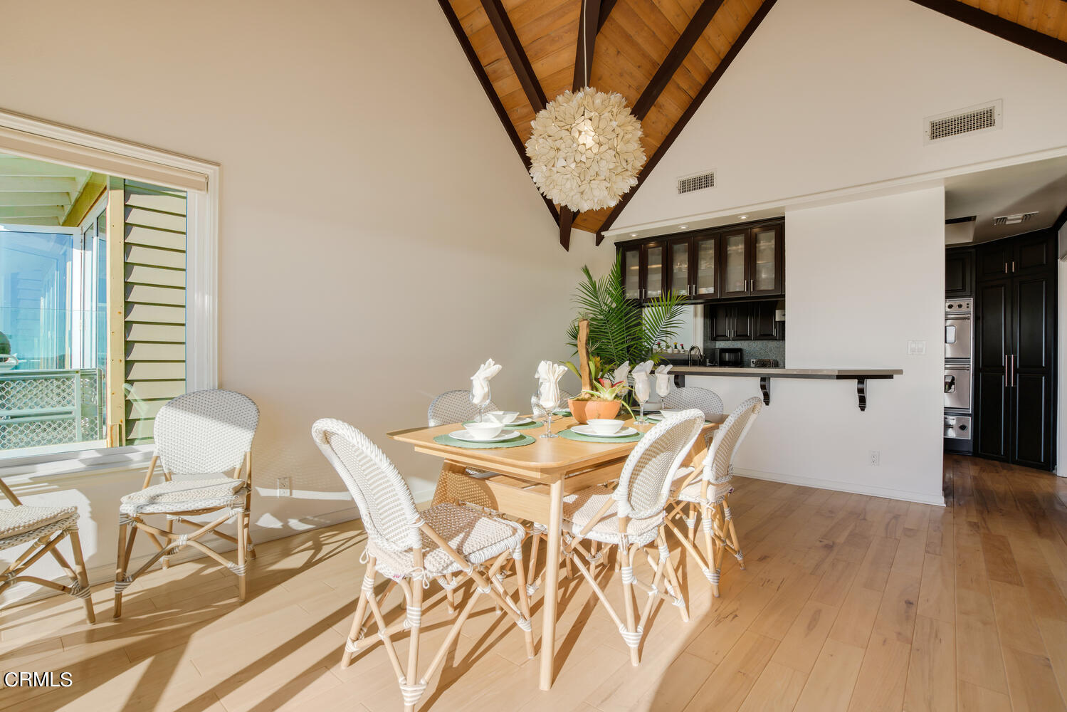 3817 Ocean Drive Oxnard, CA 93035 - Photo 17 of 51 a view of a dining room with furniture and wooden floor