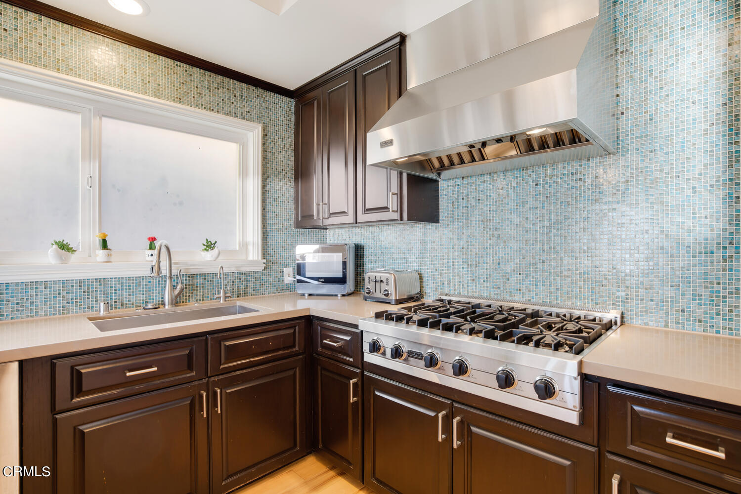 3817 Ocean Drive Oxnard, CA 93035 - Photo 22 of 51 a kitchen with a stove and a sink