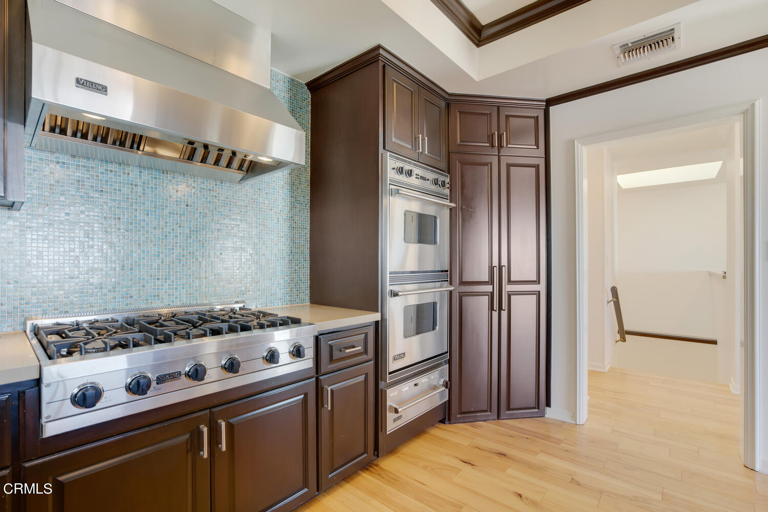 3817 Ocean Drive Oxnard, CA 93035 - Photo 24 of 51 a kitchen with granite countertop a stove and a refrigerator