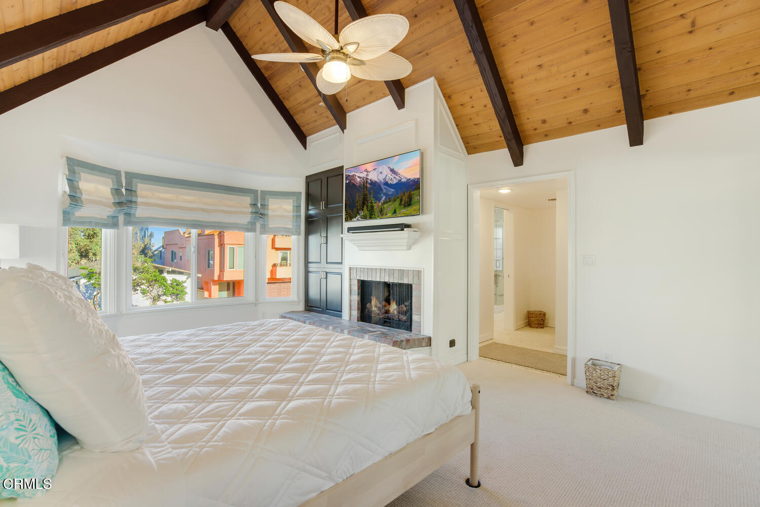 3817 Ocean Drive Oxnard, CA 93035 - Photo 26 of 51 a view of a livingroom with a fireplace a ceiling fan and window