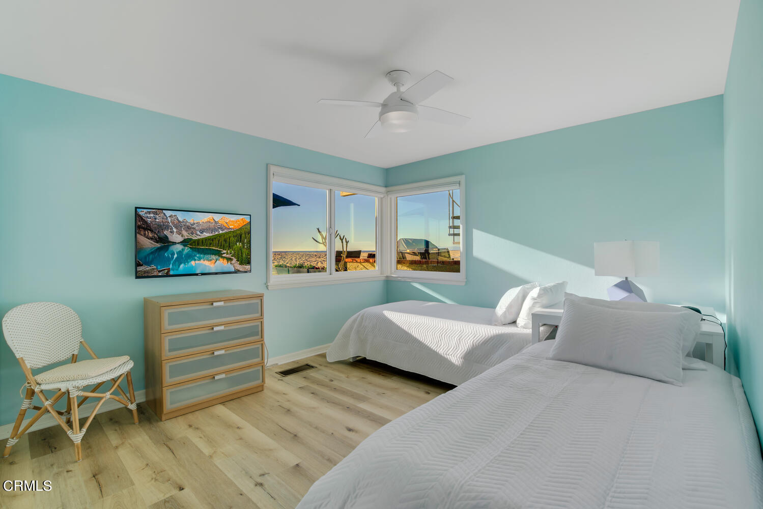 3817 Ocean Drive Oxnard, CA 93035 - Photo 32 of 51 a bedroom with furniture and a flat screen tv