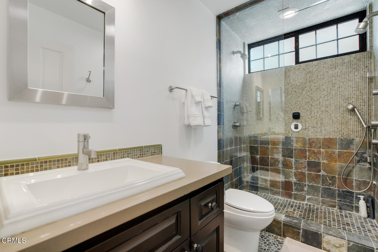 3817 Ocean Drive Oxnard, CA 93035 - Photo 34 of 51 a bathroom with a sink a toilet and shower