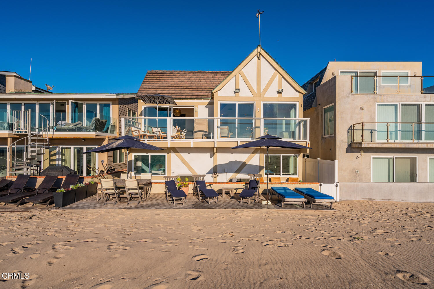3817 Ocean Drive Oxnard, CA 93035 - Photo 42 of 51 a front view of a house with large windows