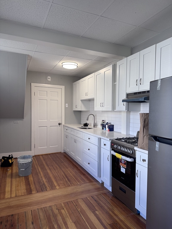 36 Endicott Street, Unit 1R Salem, MA 01970 - Photo 2 of 9 a kitchen with cabinets appliances and a counter top space