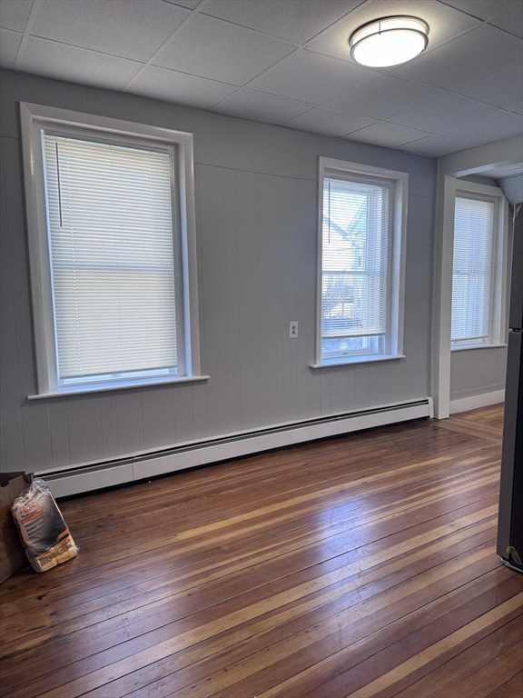36 Endicott Street, Unit 1R Salem, MA 01970 - Photo 3 of 9 a view of an empty room with wooden floor and a window