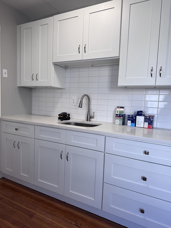 36 Endicott Street, Unit 1R Salem, MA 01970 - Photo 5 of 9 a kitchen with white cabinets and a sink