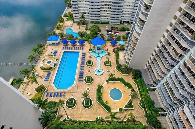 a kitchen with stainless steel appliances a stove a sink and a refrigerator