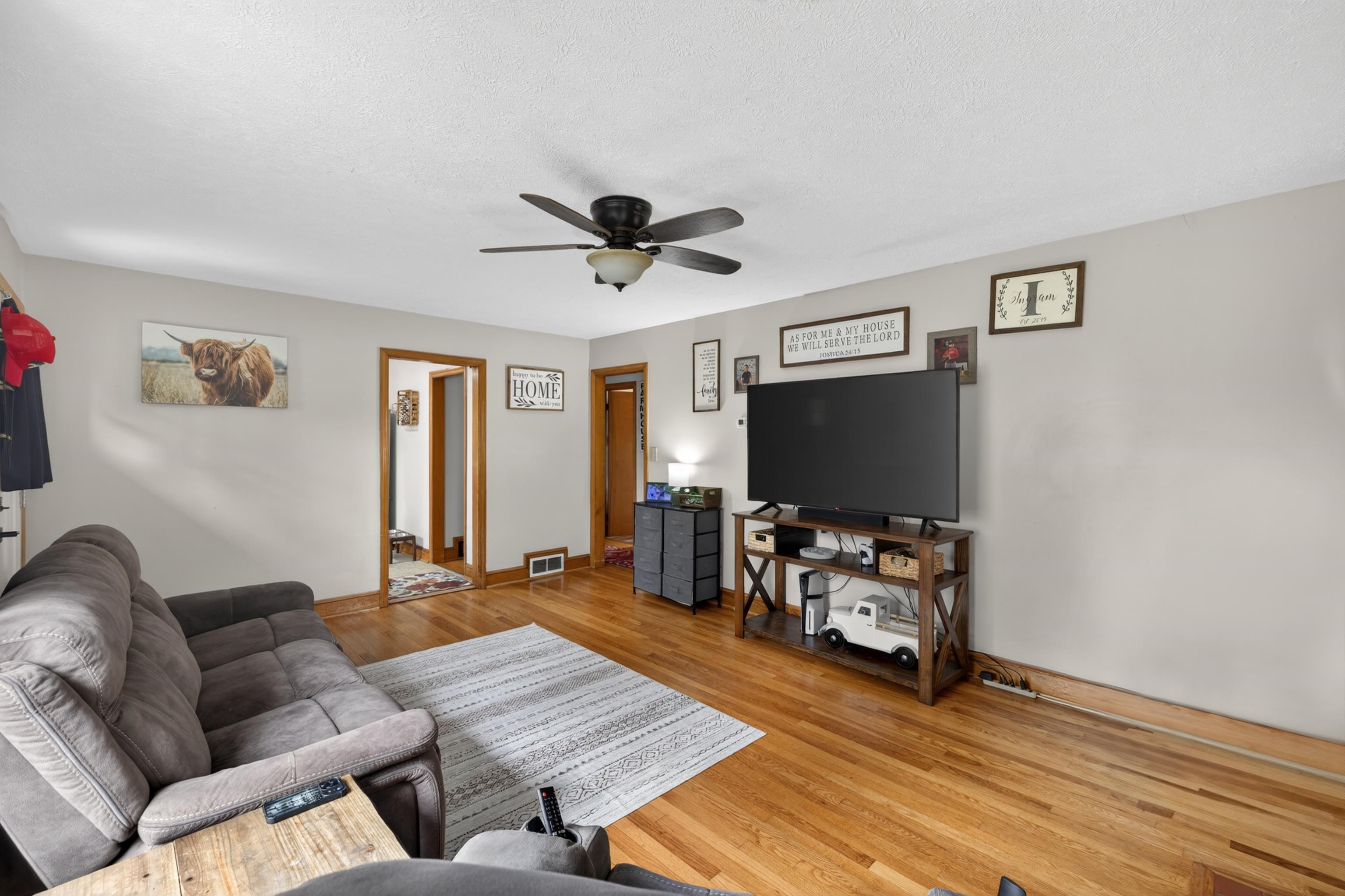 7827 Lee Highway Raphine, VA 24472 - Photo 15 of 62 a living room with furniture and a flat screen tv