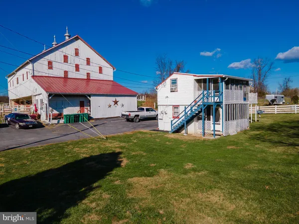 a front view of a house with a yard table and chairs