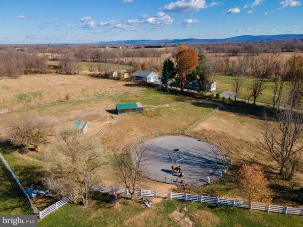 a view of a lake with lawn chairs