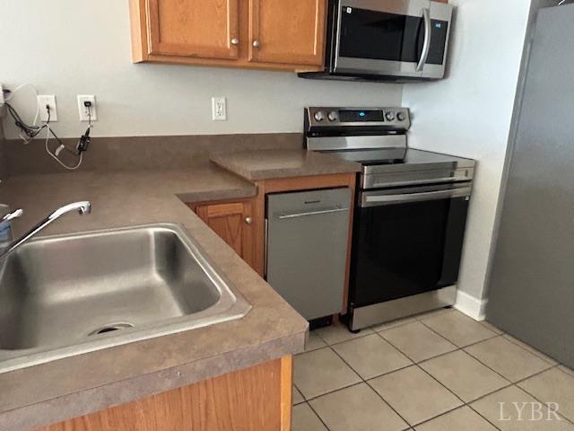 1273 Graves Harbor Trail, Unit 318 Huddleston, VA 24104 - Photo 13 of 21 a kitchen with stainless steel appliances granite countertop a sink and a stove