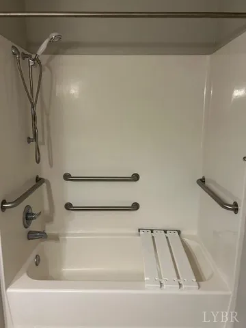 a bathroom with a shower and a sink