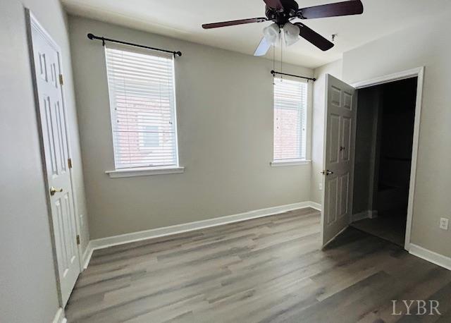 1273 Graves Harbor Trail, Unit 318 Huddleston, VA 24104 - Photo 17 of 21 a view of an empty room with wooden floor and a window