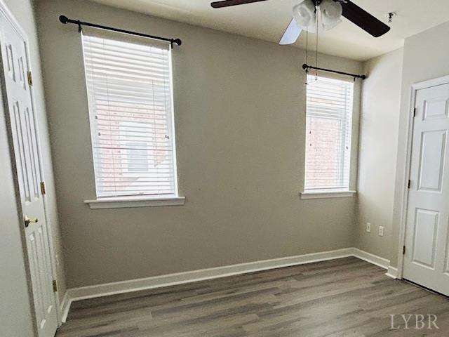 1273 Graves Harbor Trail, Unit 318 Huddleston, VA 24104 - Photo 18 of 21 a view of an empty room with a window and wooden floor