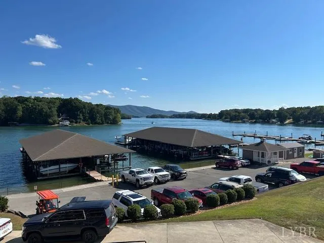 a view of yard with cars and car parked
