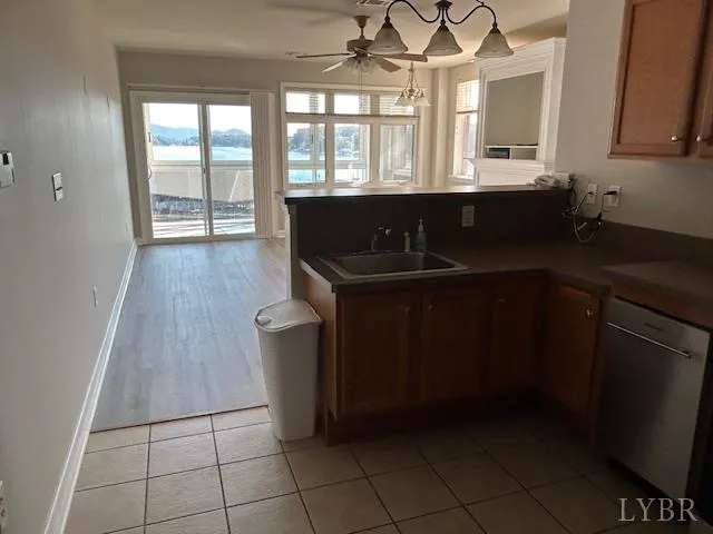 a kitchen with a sink a stove and cabinets