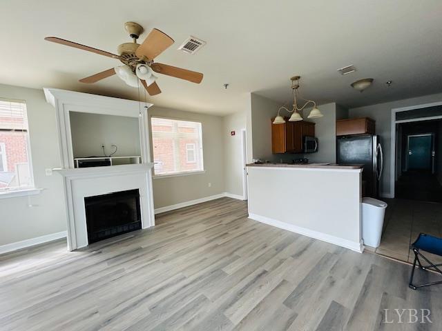 1273 Graves Harbor Trail, Unit 318 Huddleston, VA 24104 - Photo 10 of 21 a living room with furniture and a fireplace