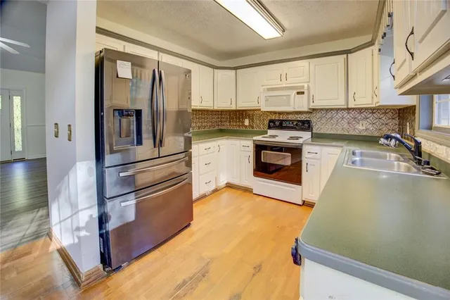 a view of a kitchen with window and stainless steel appliances