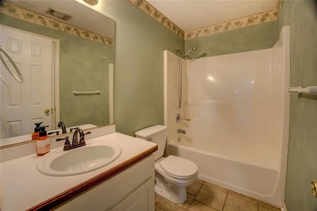 a bathroom with a shower and a toilet