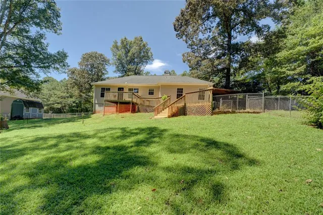 a view of backyard with green space
