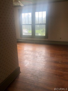4762 Three Chopt Road Louisa, VA 23093 - Photo 3 of 6 an empty room with wooden floor and windows