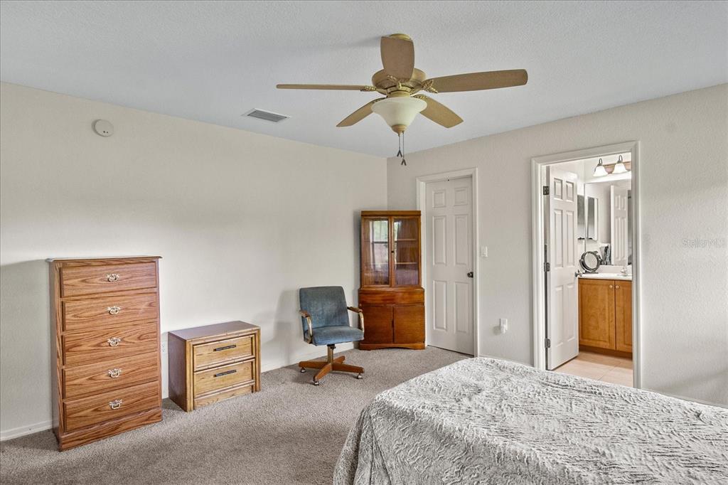 30 Milky Way Venus, FL 33960 - Photo 18 of 45 a bedroom with a bed and furniture