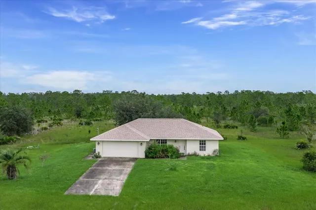 a view of a garden with a building in the background