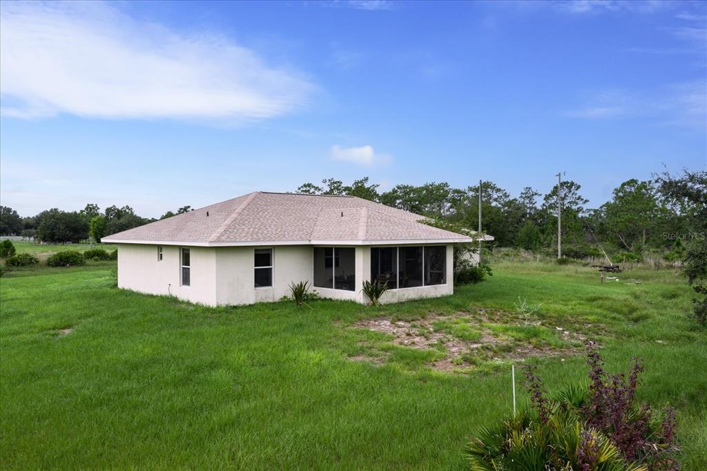 30 Milky Way Venus, FL 33960 - Photo 40 of 45 a front view of a house with a yard