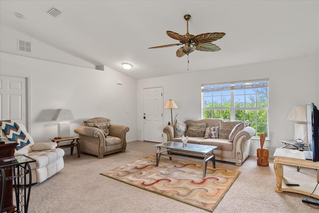 30 Milky Way Venus, FL 33960 - Photo 4 of 45 a living room with furniture and a large window