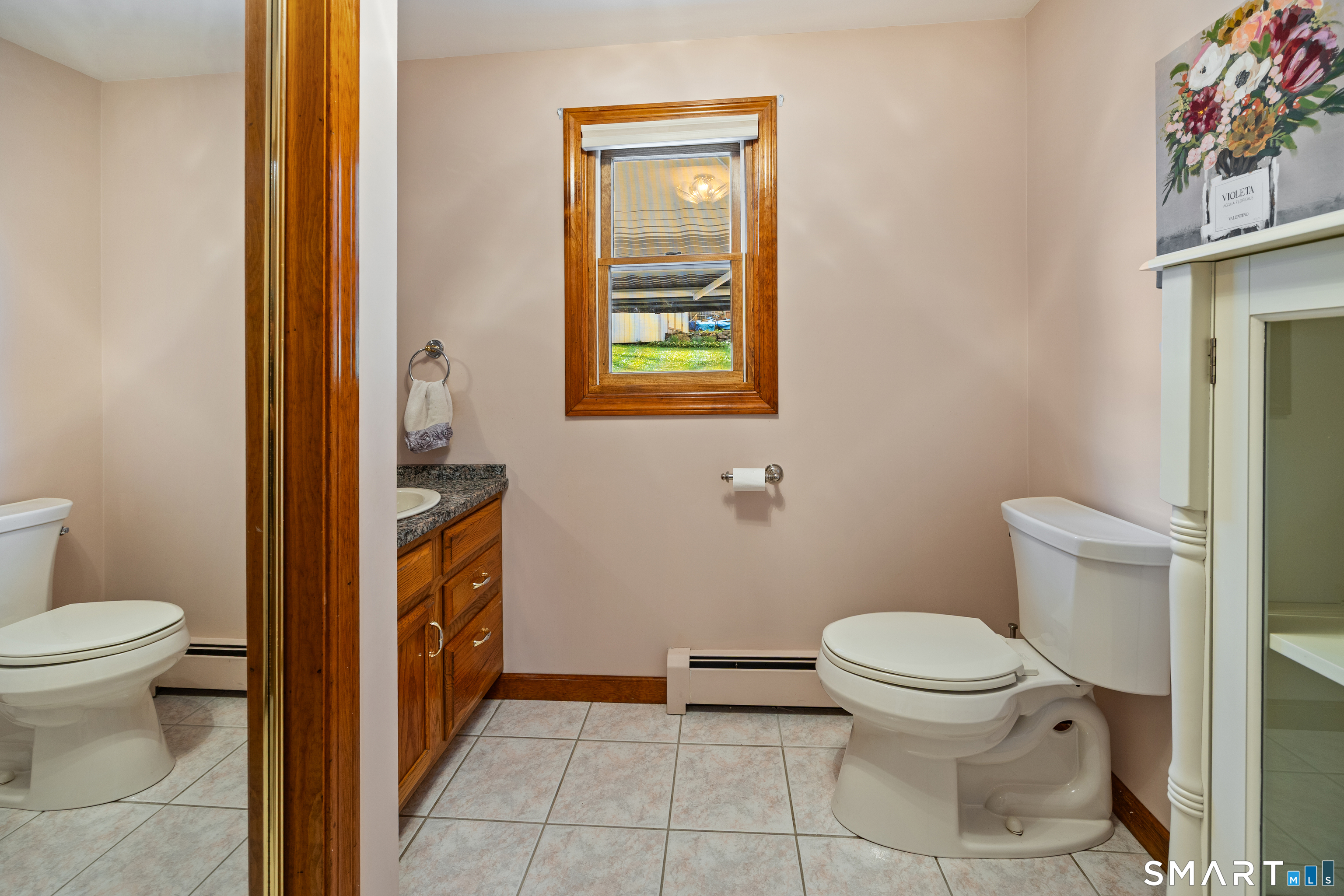 42 Chimney Sweep Road Wallingford, CT 06492 - Photo 20 of 40 a bathroom with a toilet and a sink