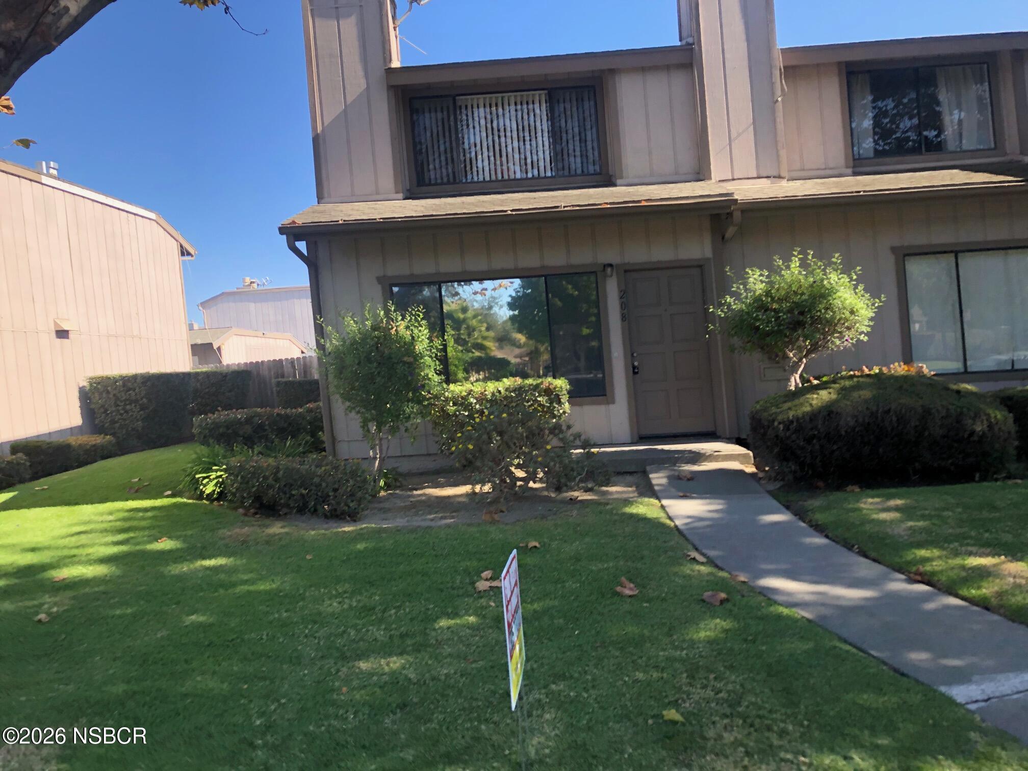 208 North R Street Lompoc, CA 93436 - Photo 22 of 22 a backyard of a house with lots of green space