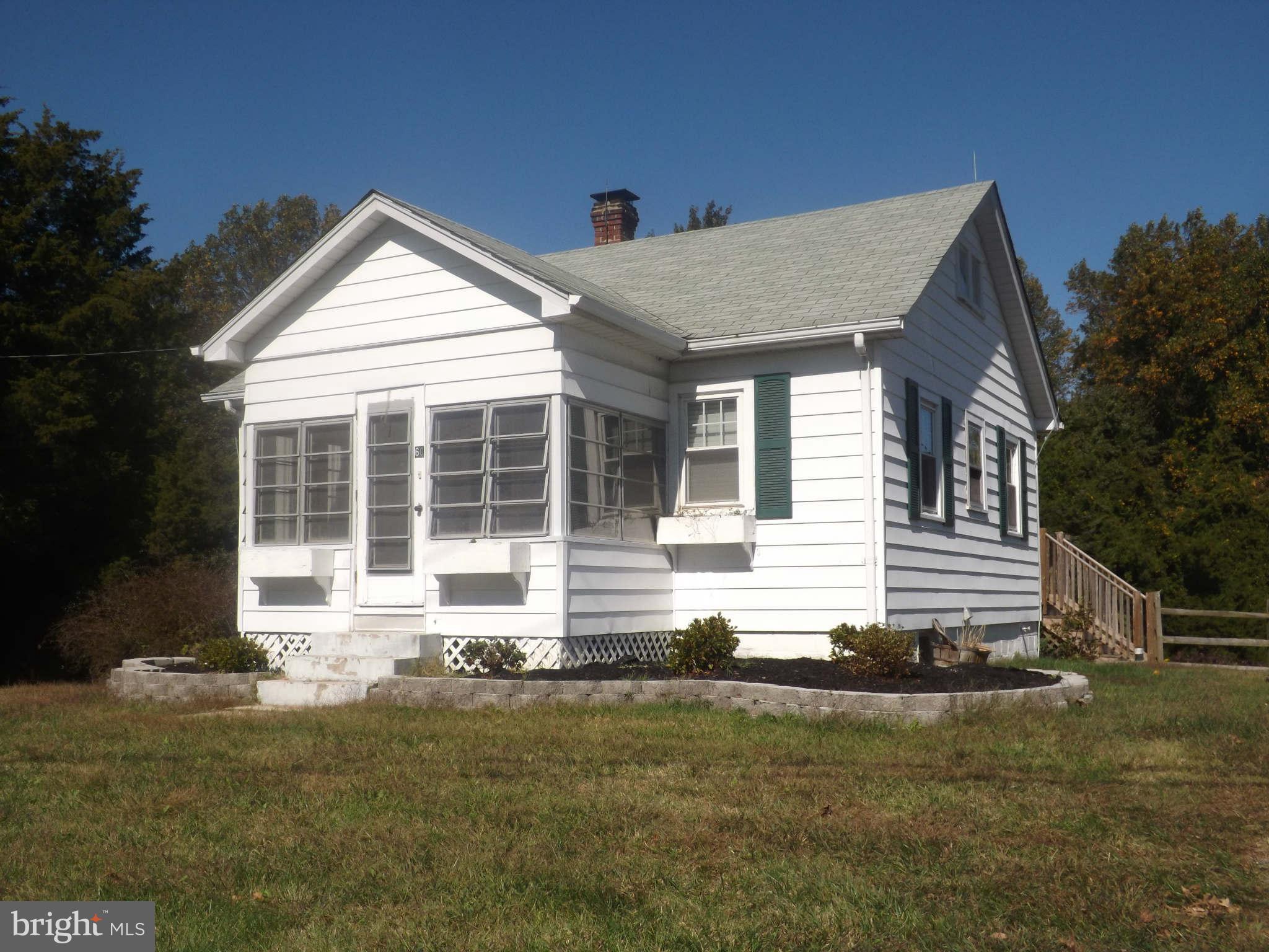 60 Cox Road Huntingtown, MD 20639 - Photo 1 of 15 a front view of a house with a yard