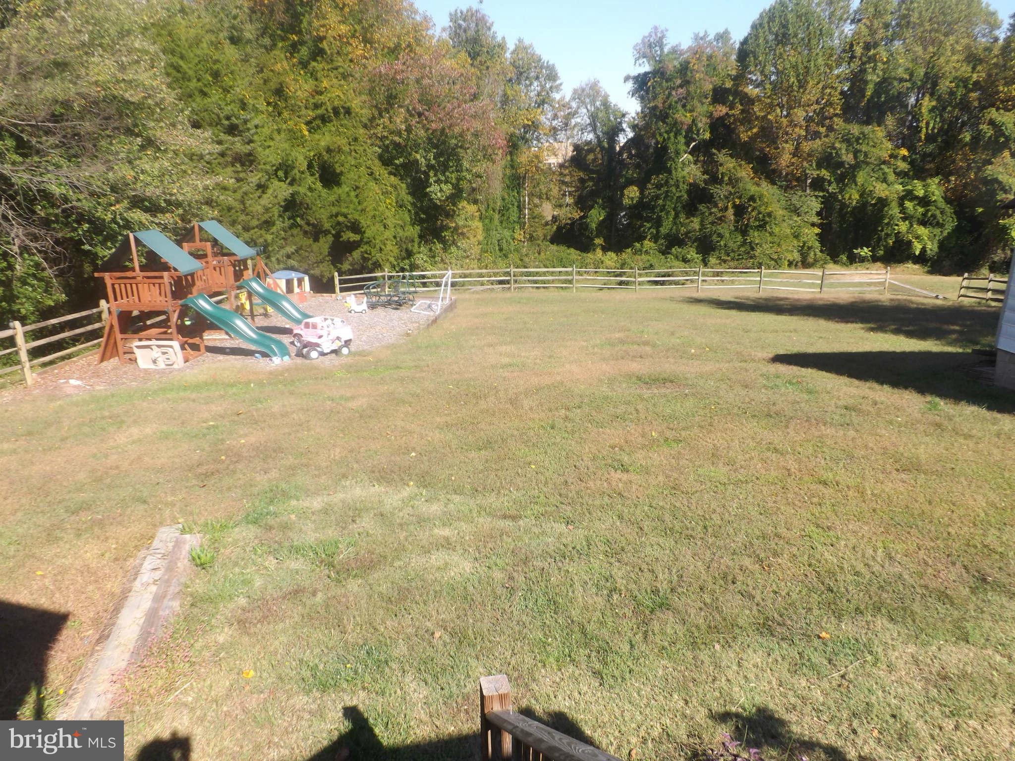 60 Cox Road Huntingtown, MD 20639 - Photo 12 of 15 a view of a yard with an outdoor space