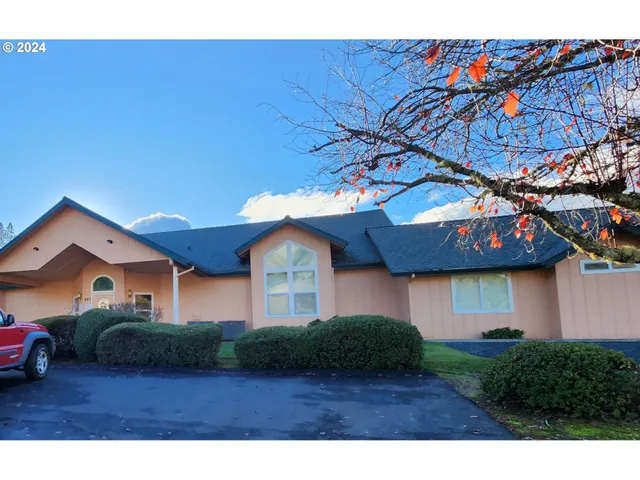a view of a front of a house with a street