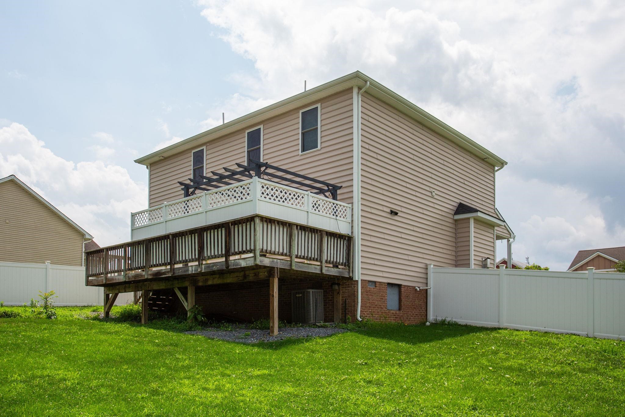 315 Rustic Avenue Broadway, VA 22815 - Photo 18 of 19 large rear deck with pergola and showing crawl space access.