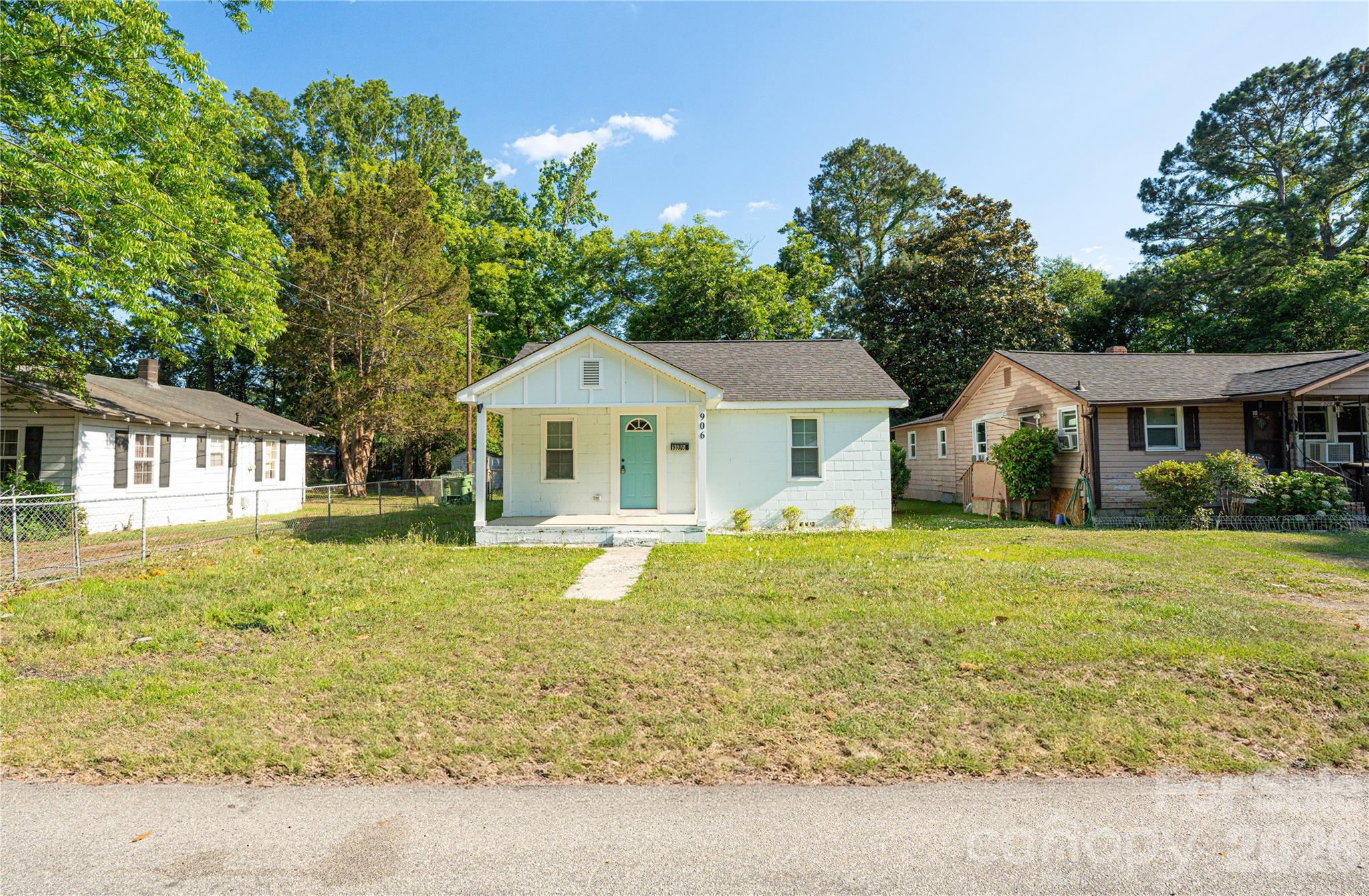 a front view of house with outdoor seating and yard
