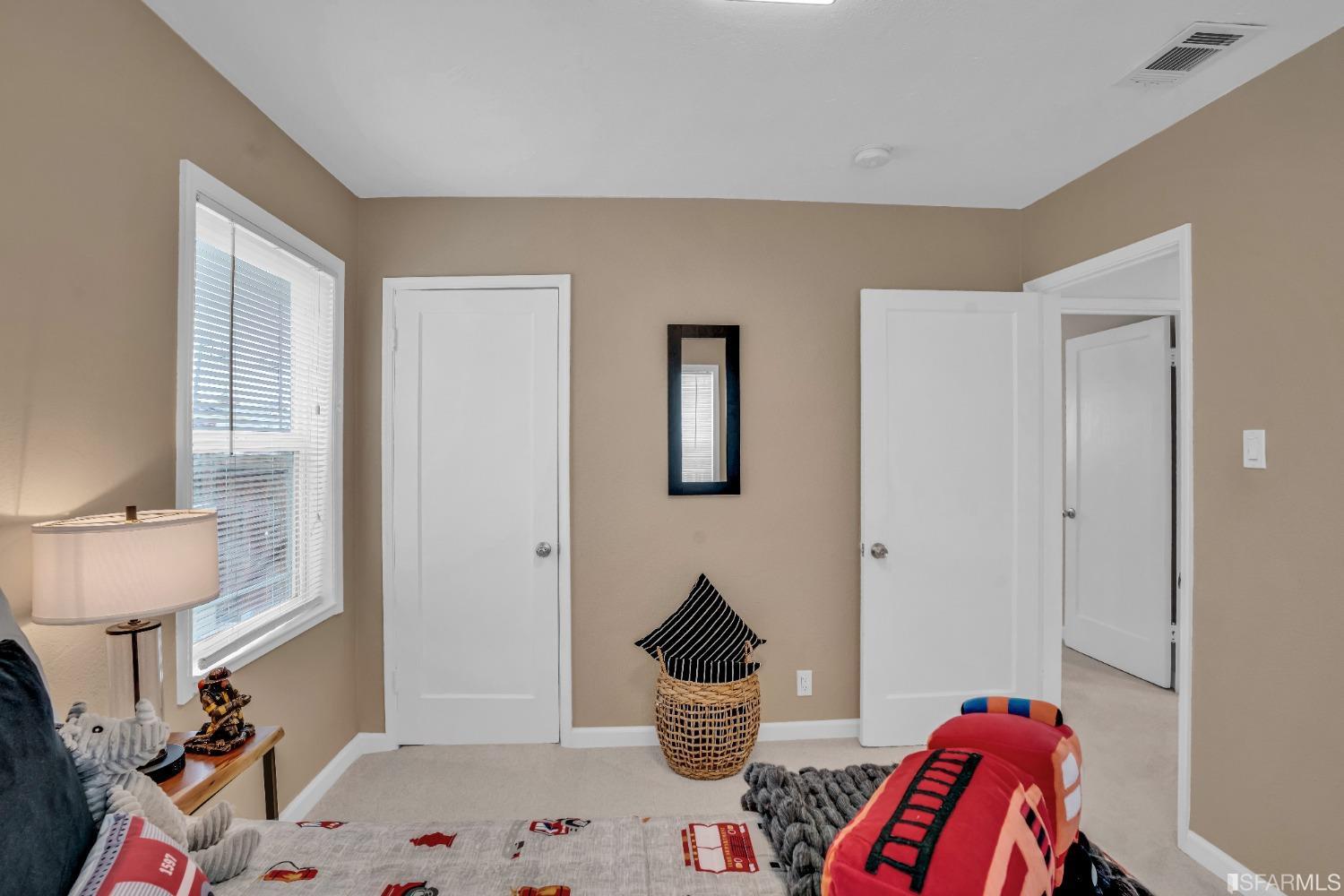 476 Violet Street San Leandro, CA 94578 - Photo 20 of 30 a bedroom with furniture and a wooden floor